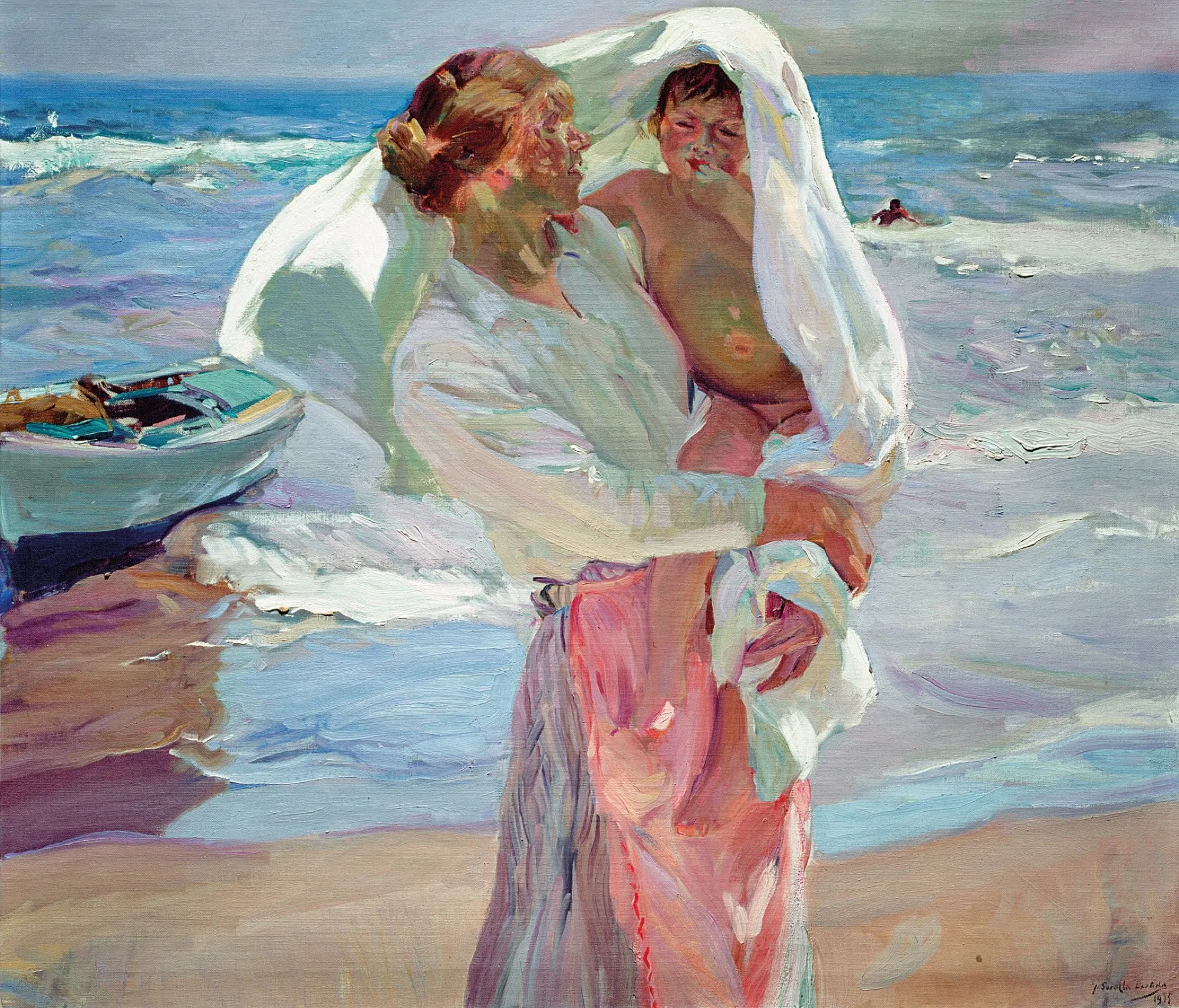 A woman wraps a child in a white towel at the water's edge, a blue fishing boat drawn up on the sand behind them and a bather in the surf beyond.