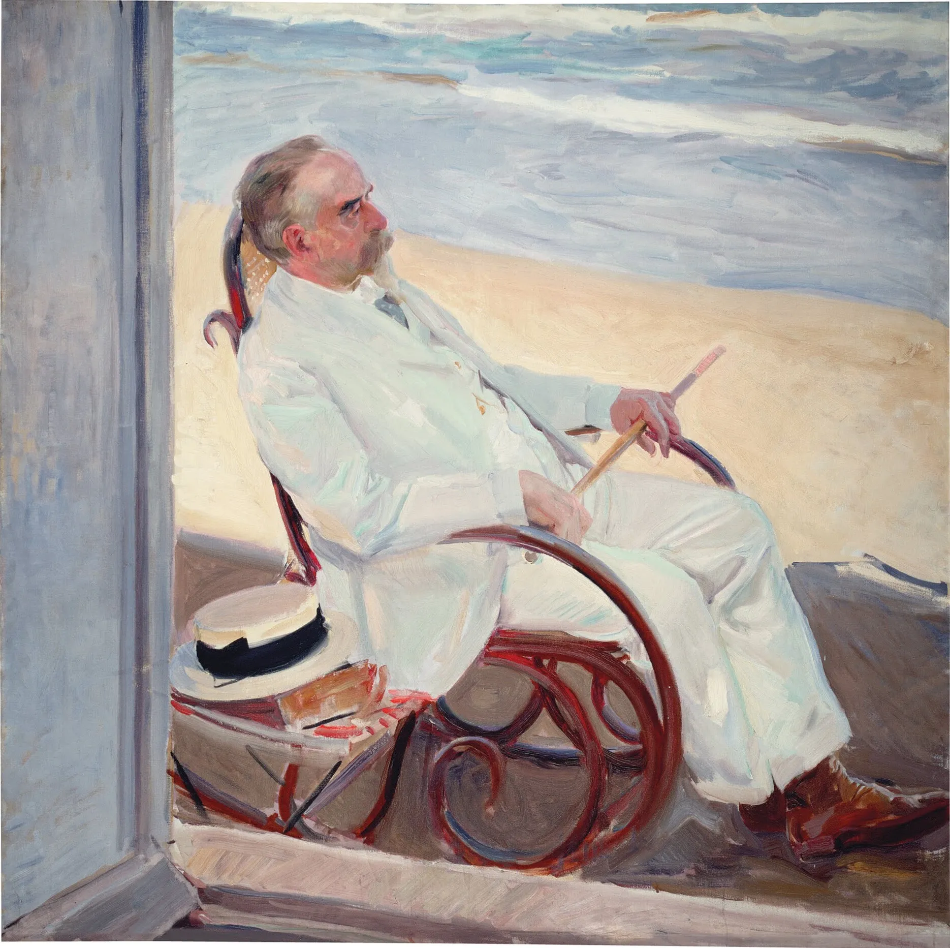 Antonio García, the artist's father-in-law, sits on the sunlit beach in a white suit and hat, at ease against the bright sea.