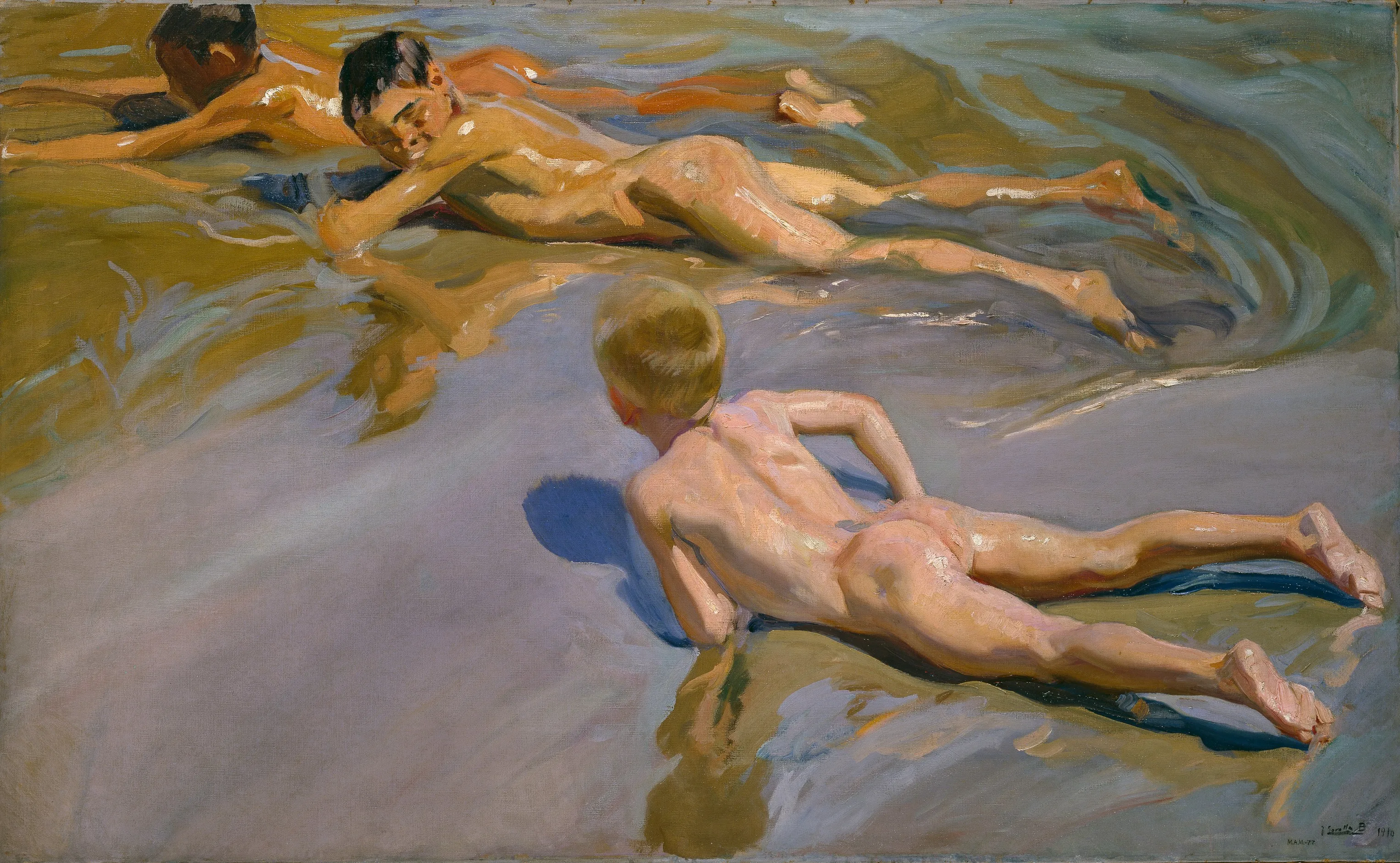Three naked boys lie belly-down in the shallows of a sunlit Valencian beach, their wet backs and the rippling turquoise water shot through with reflected light.