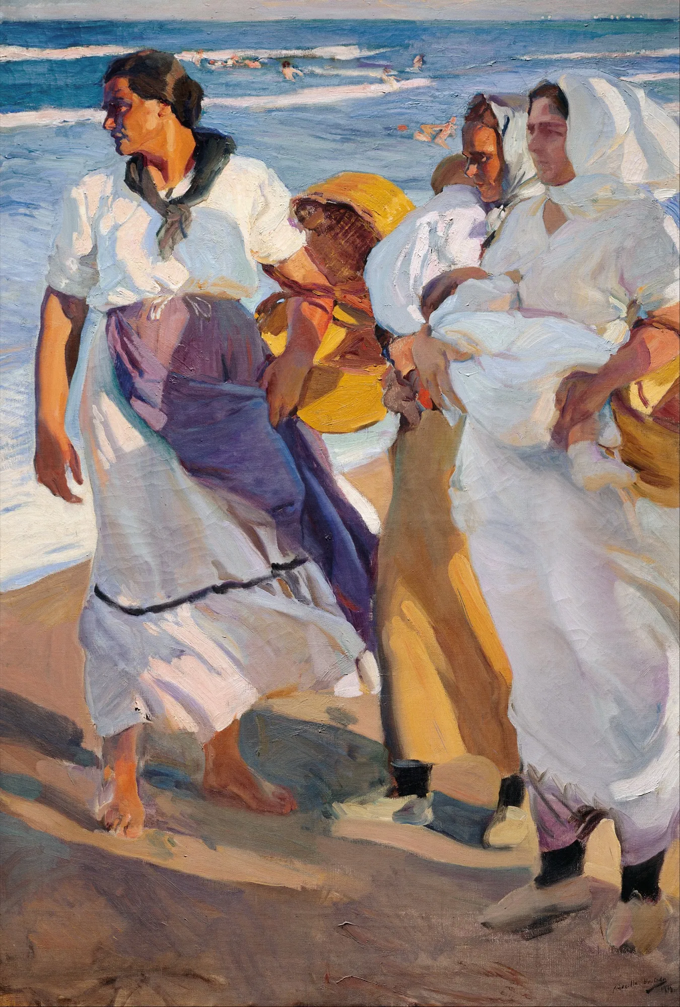 Three fisherwomen in white blouses and long skirts walk barefoot along the wet sand carrying baskets, the surf and distant bathers behind them in bright coastal light.