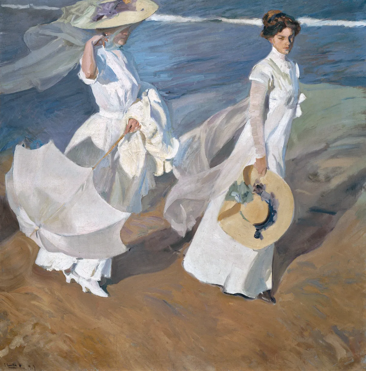 Two elegant women in flowing white dresses and veils stroll along the shoreline, their gauzy fabrics and a parasol billowing in the sea breeze.